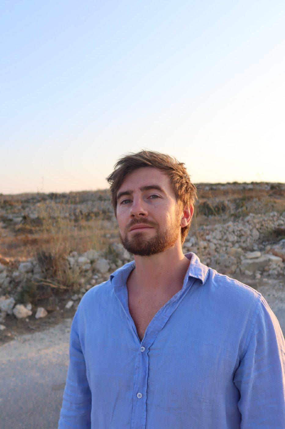 Portrait of Jamie MacPherson at golden hour in Gozo, Malta