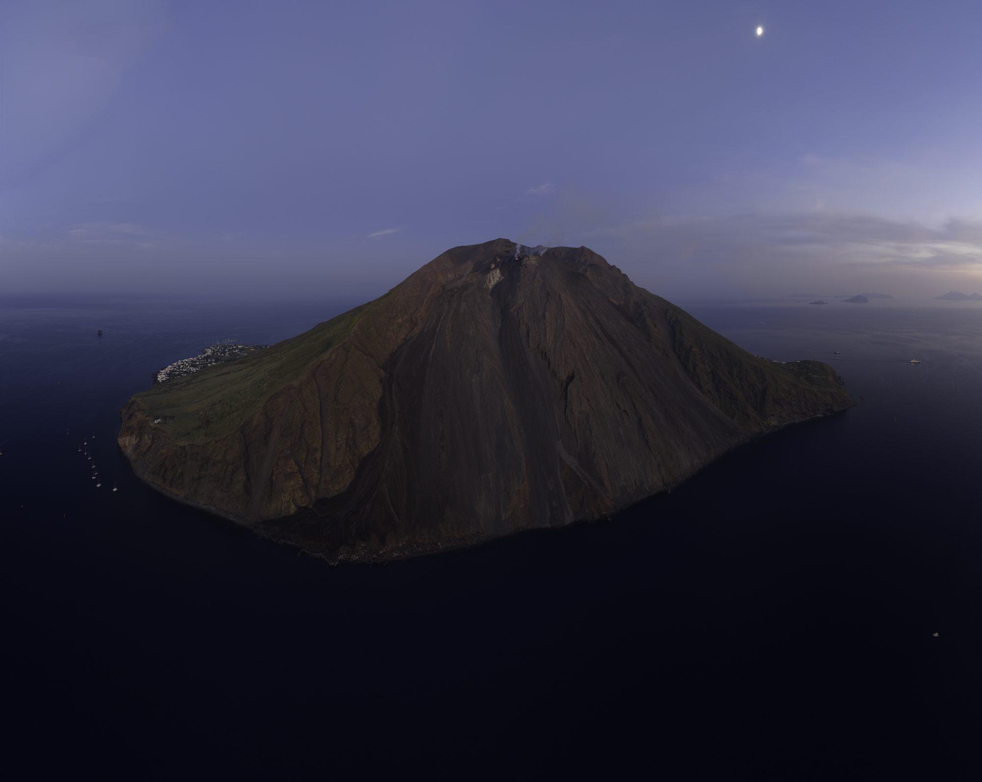 Aerial view of a volcanic island at dusk